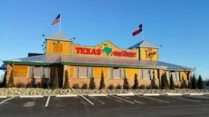 Exterior view of the Vestal Texas Roadhouse restaurant building.