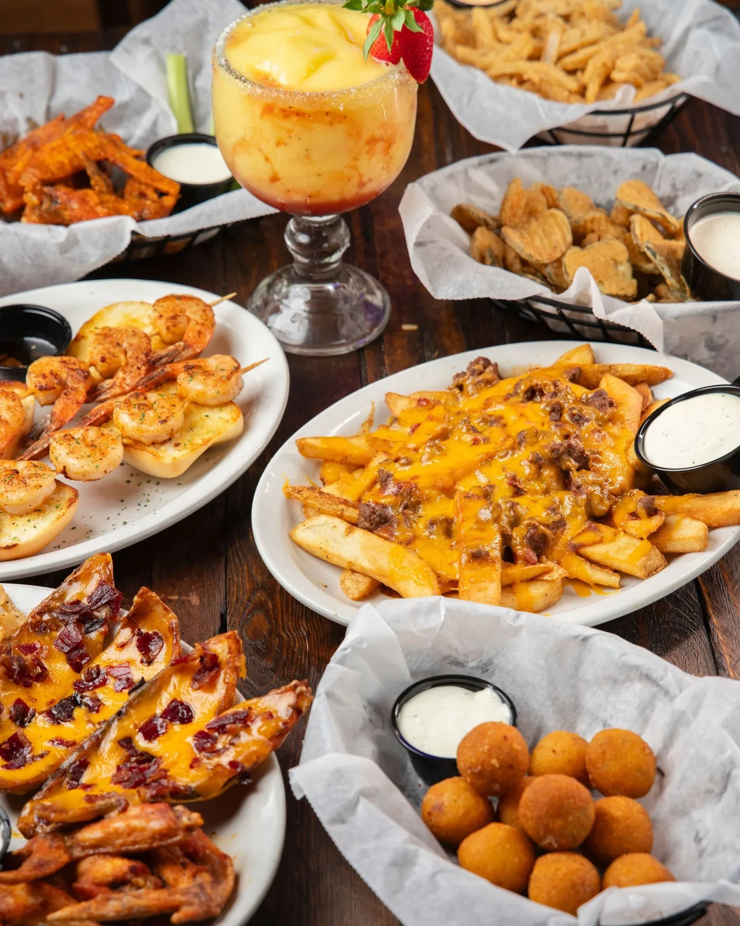 Texas Roadhouse appetizers spread featuring cheese fries