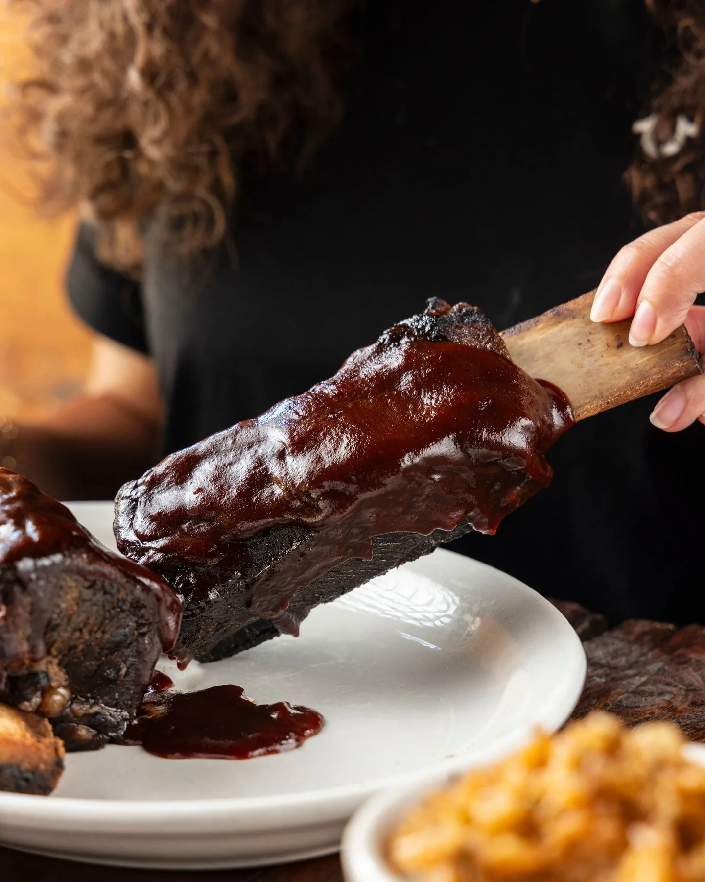 Texas Roadhouse ribs coated in rich barbecue sauce