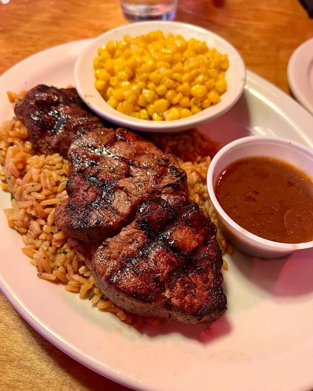 Texas Roadhouse hand-cut steak served with seasoned rice