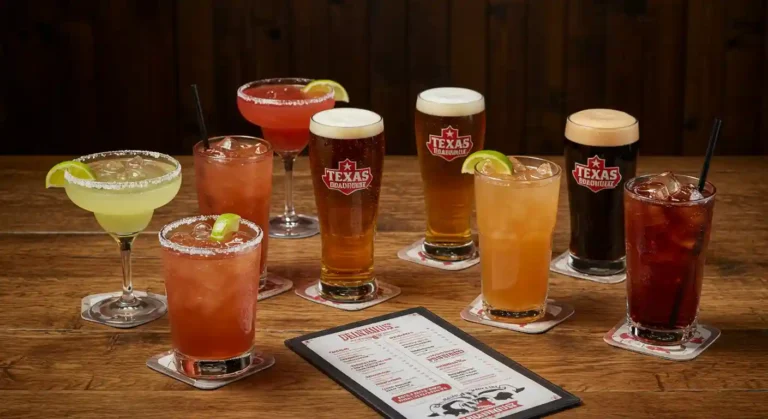 Texas Roadhouse bar table displaying colorful beverages and cocktails with a visible drink menu in a casual, warmly lit setting.