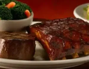 A 6oz filet with ribs and vegetables, served at the Vestal Texas Roadhouse.