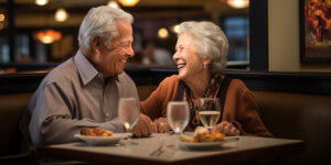 Senior couple enjoying dinner at a restaurant.